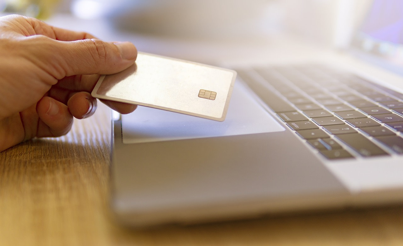 A person using a credit card to purchase something online.