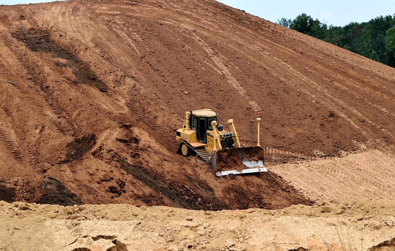 A bulldozer digging a hole.