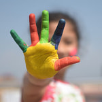 A girl holding up five fingers - yourmoneyvehicle.com