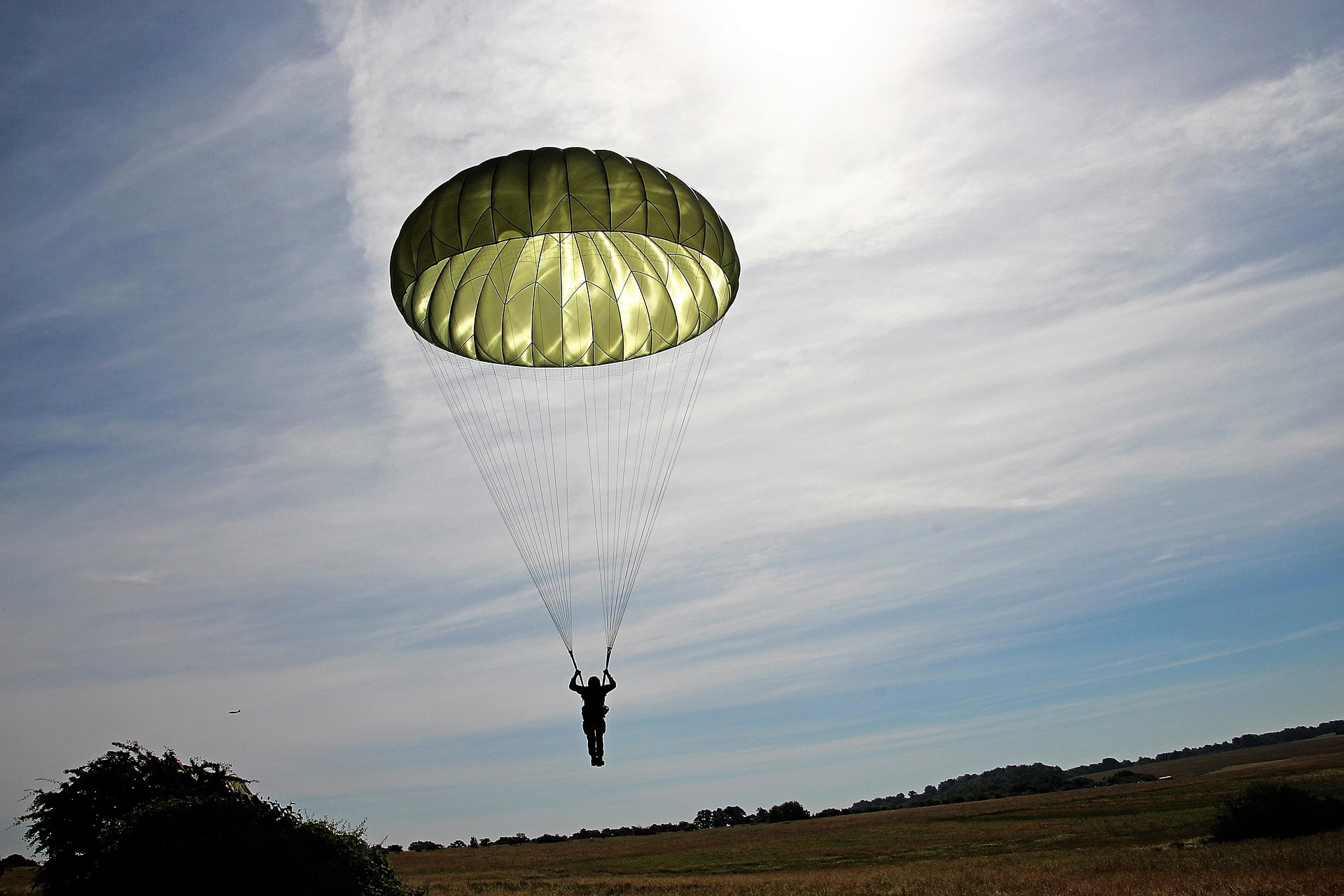 A skydiver comes in for a landing.
