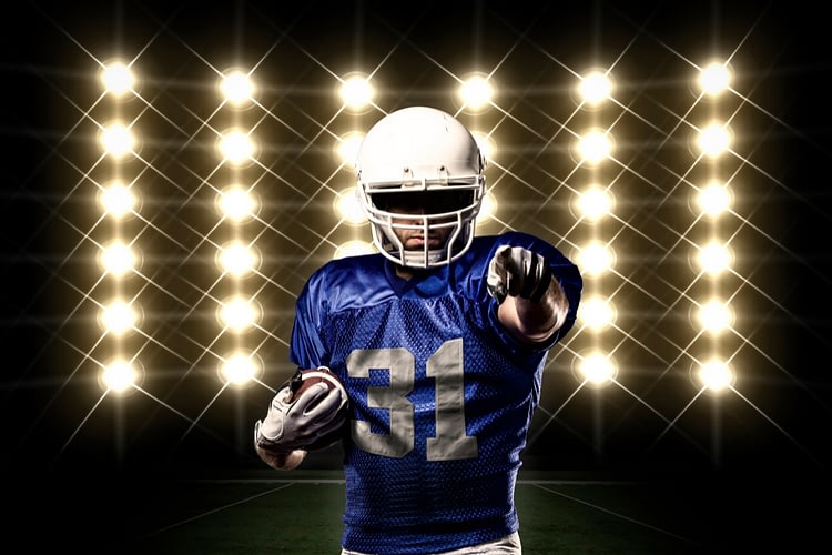 football player with blue uniform front lights